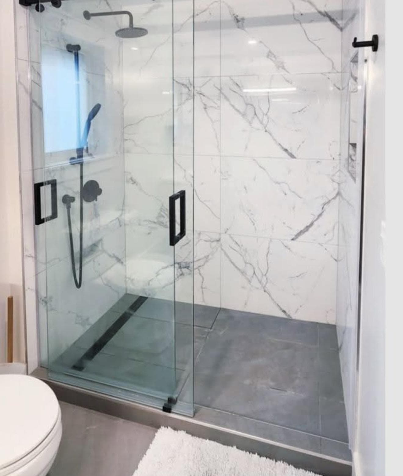Technician installing a tempered glass door